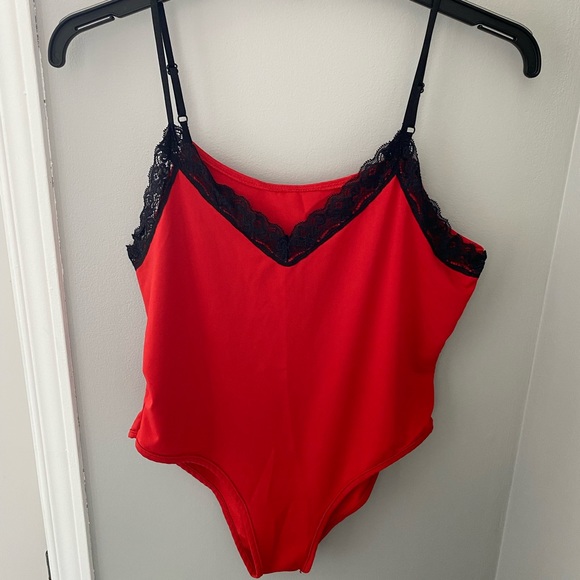 Tops - Red bodysuit with black lace trim around neck/chest line and elastic straps